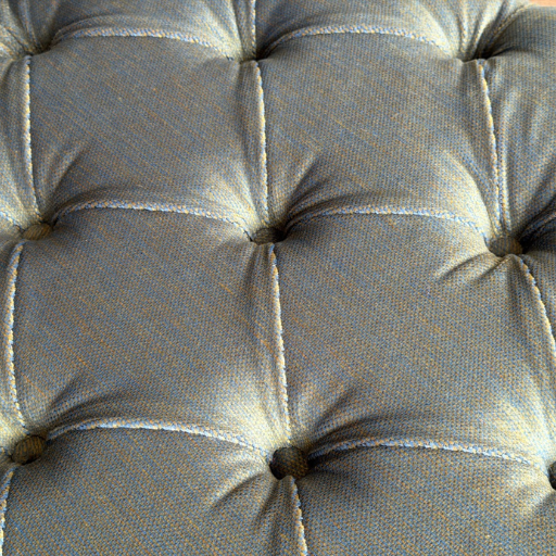 Luxe capitonné ottoman hocker in diepe blauwe kleur met houten poten. Perfect als voetenbank, extra zitplaats of stijlvolle blikvanger in de woonkamer.